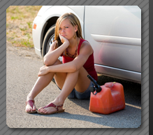 Woman out of gas in need of Roadside Assistance Services.